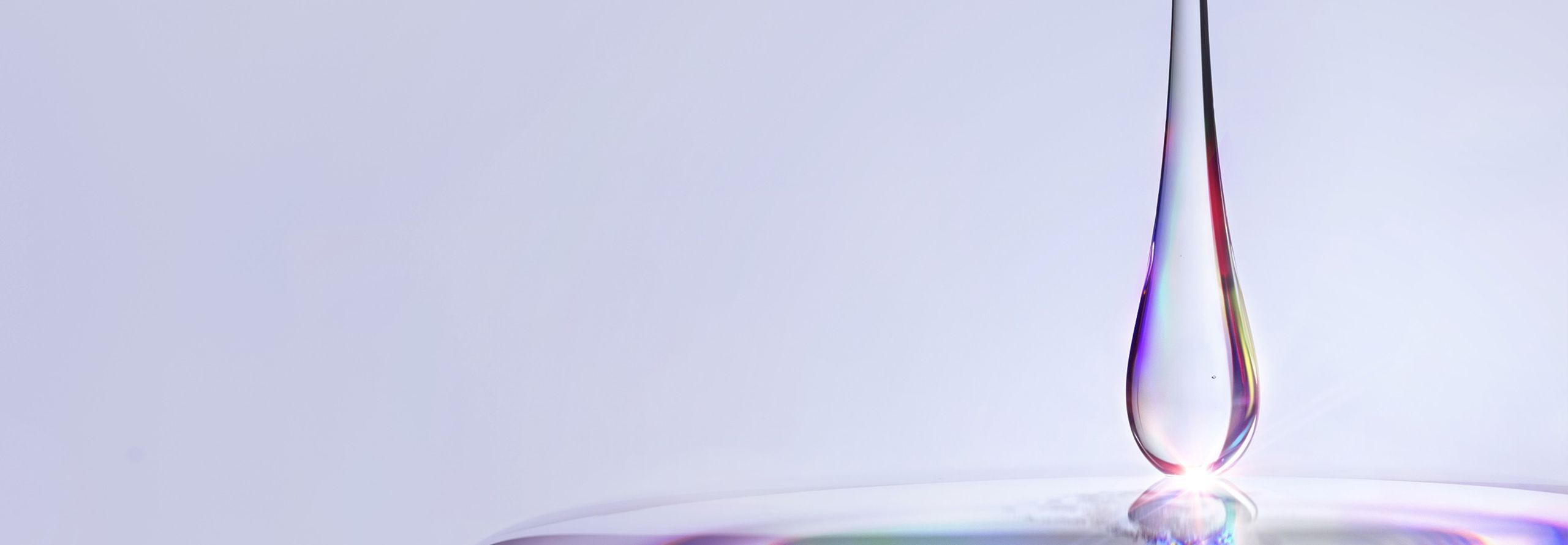 Drop of hyaluronic acid gel on an irridescent background